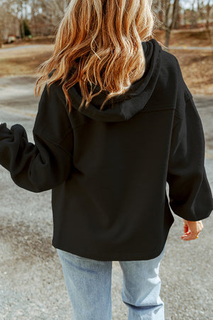 Black textured utility hoodie jacket with a relaxed fit and long sleeves.