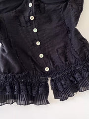 Black lace ruffle hem tank top with button front and frill details.