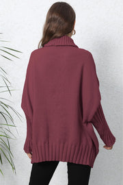 Burgundy knit turtleneck sweater with batwing sleeves and ribbed cuffs and hem.