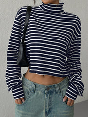 Striped cropped ribbed turtleneck sweater with a mock neck and long sleeves.