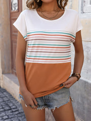 Colorblock stripe t-shirt in white with colorful horizontal stripes and a burnt orange bottom.