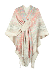 Knit wrap coat with pastel stripes, faux fur clasp, and pom-pom trim.