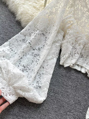 White sheer floral lace shirt with balloon sleeves and tie-back detail.