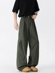 Men's oversized wide-leg jeans in green, 100% cotton, with a relaxed fit and unique paneling.