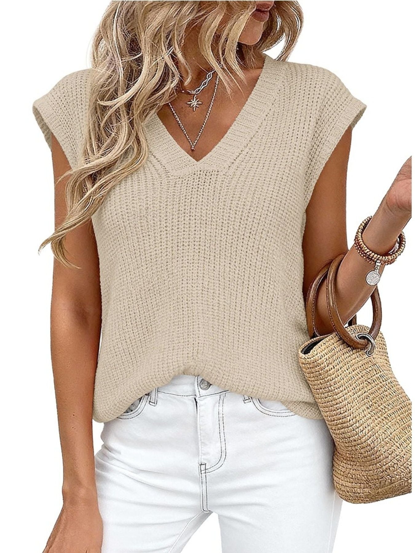 Textured apricot knit V-neck sweater vest with cap sleeves.