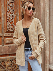 Tan textured knit cardigan with pockets and ribbed cuffs, open front.