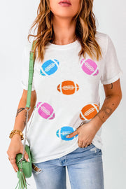 White t-shirt with rolled sleeves and scattered colorful football graphics.