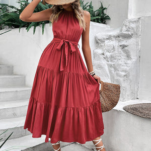 Burgundy halter neck tiered midi dress with belted waist and 100% viscose fabric.