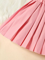 Charming three-piece toddler set in red, pink, or blue.