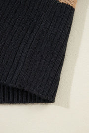 Chunky knit black cardigan with a tan stripe detail.