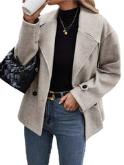 Light gray double-breasted wool blend pea coat with black buttons and notched lapels.