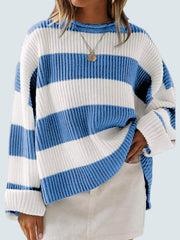 Blue and white striped oversized knit sweater with crew neck and long sleeves.
