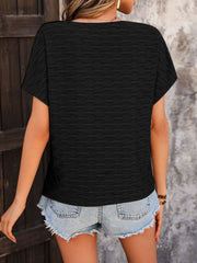 Black cap-sleeve blouse with textured wave pattern