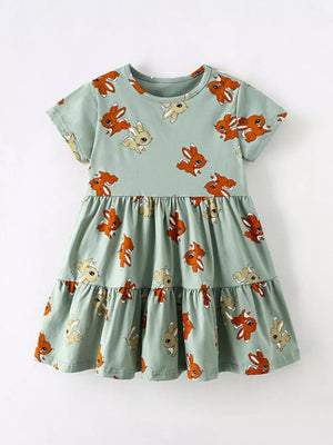 Baby tiered dress in mint green cotton blend with playful bunny print and short sleeves.