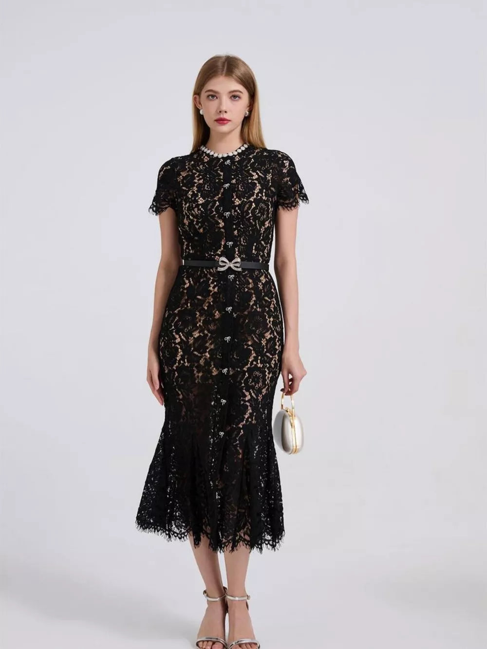 Black floral lace mermaid dress with short sleeves, pearl neckline, and bow belt.