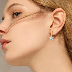 Gold celestial star huggie hoop earrings with clear crystals
