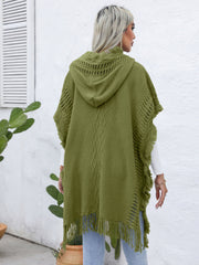 Matcha green knit poncho with fringe, hood, and diamond texture detail.