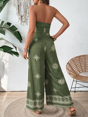 Matcha green bandeau wide-leg jumpsuit with embroidered floral pattern and border detail.