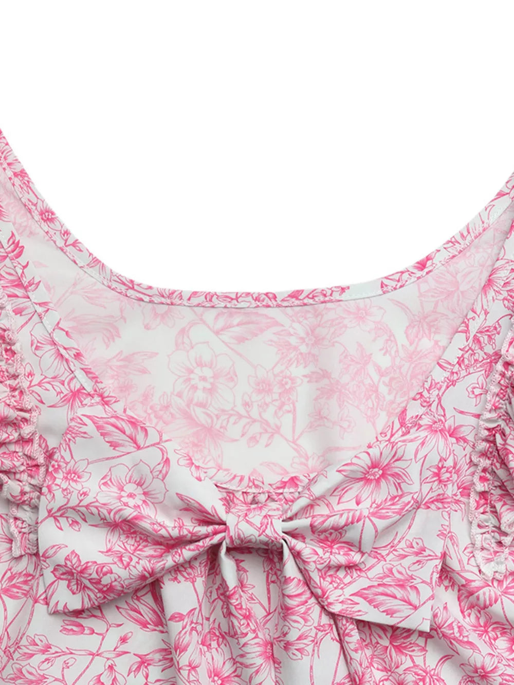 Maternity shirt with pink floral print, bow detail, and ruffle sleeves.