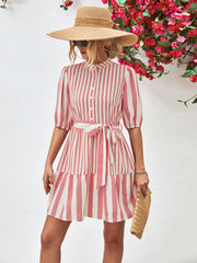 Blush pink and white striped shirred waist dress with tie belt and tiered skirt.