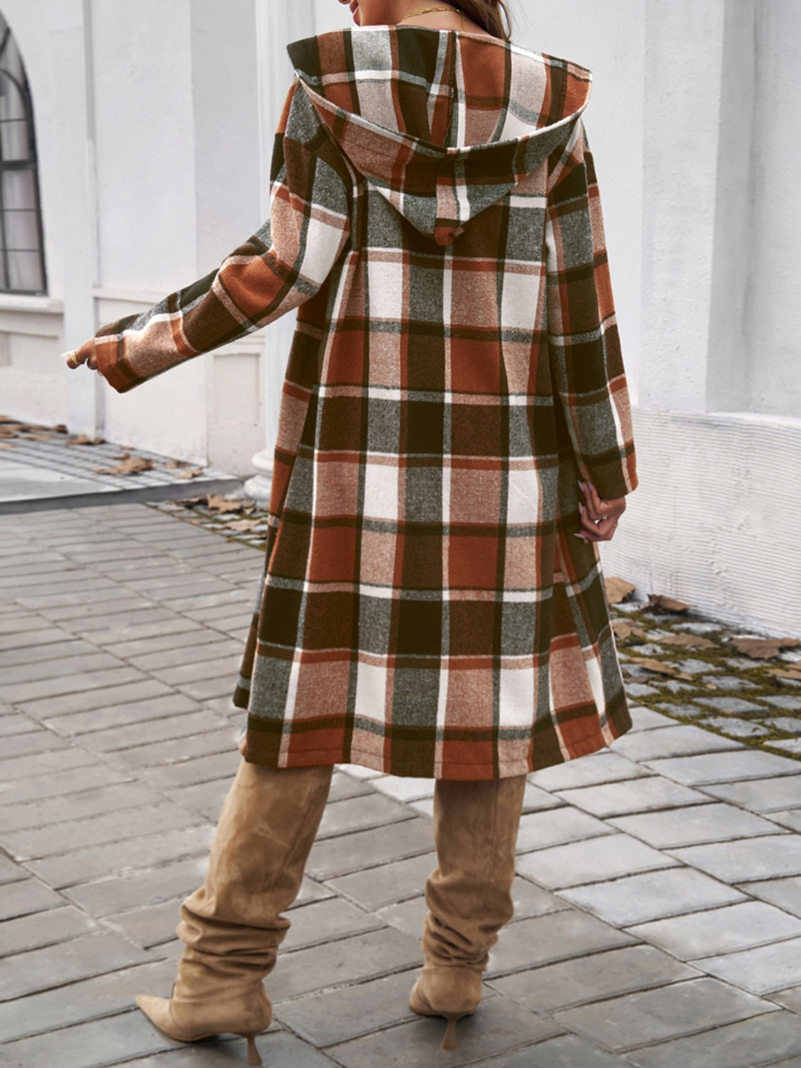 Brown plaid hooded duster coat with buttoned closure and A-line cut.
