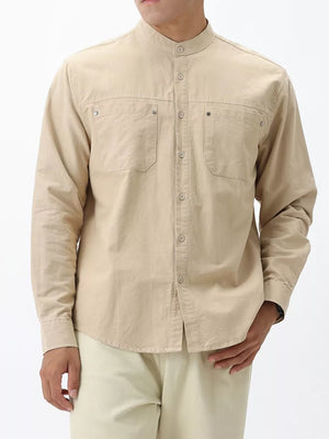 Apricot cotton casual long sleeve shirt with button-down front and two chest pockets.
