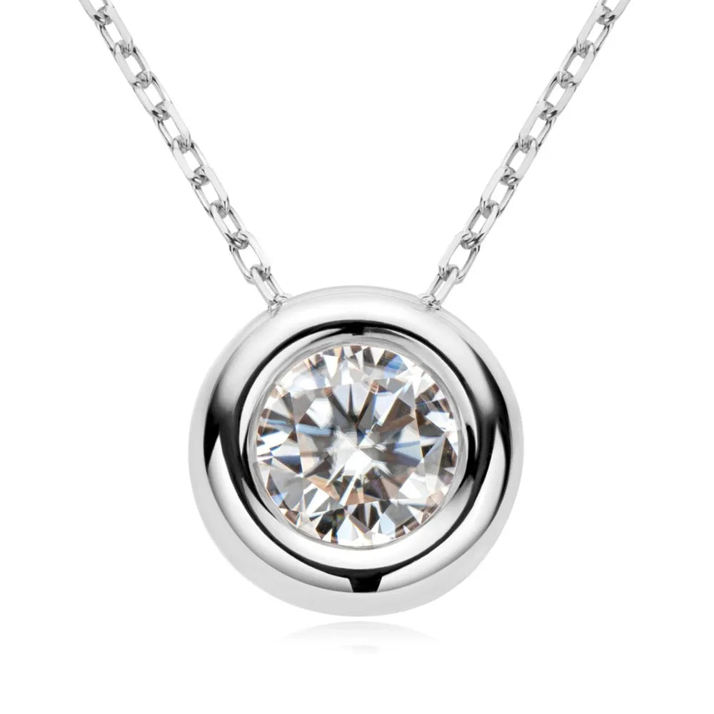 Silver solitaire pendant necklace with bezel-set diamond on a delicate chain.