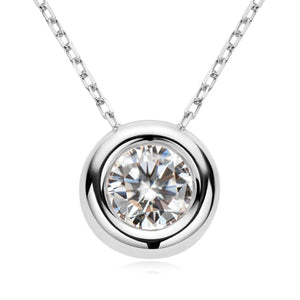 Silver solitaire pendant necklace with bezel-set diamond on a delicate chain.