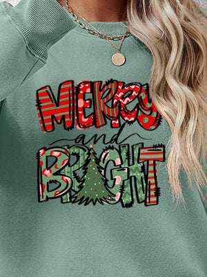 Festive graphic crewneck sweatshirt in Sage with Merry and Bright text and Christmas tree graphic.