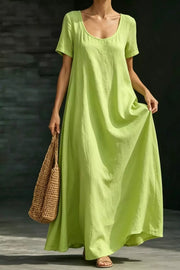 Lime maxi dress with short sleeves, scoop neck, and pockets, made of 100% polyester.