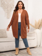 Oversized ribbed knit duster cardigan in ochre with pockets and open front.