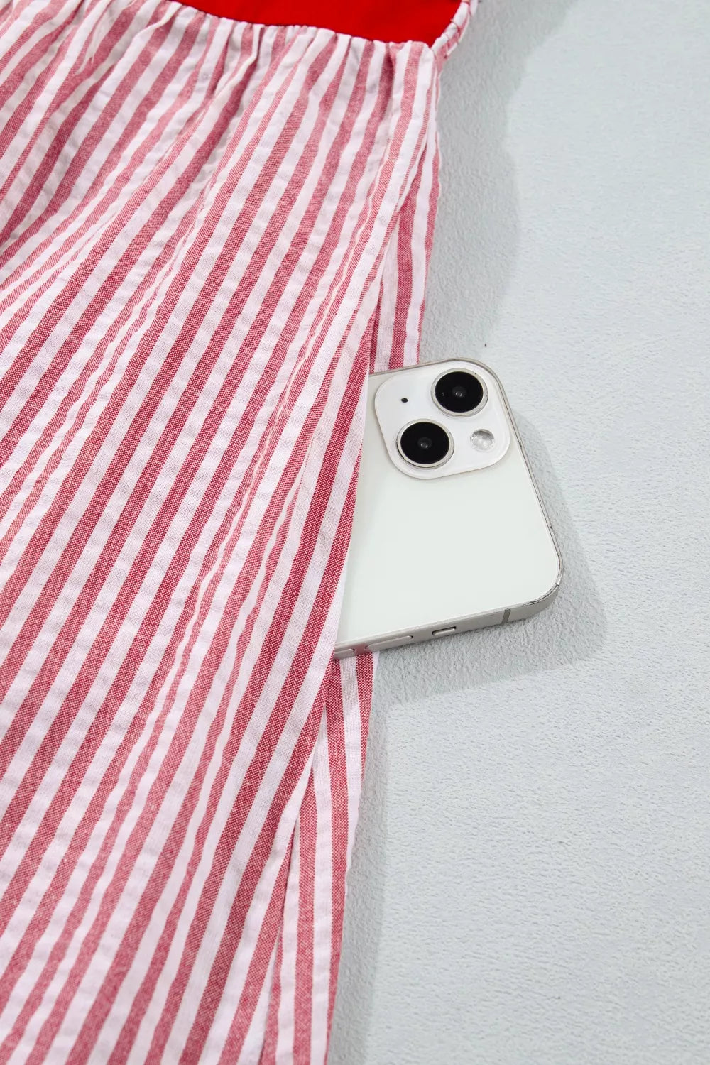 Maxi dress with red and white stripes, cotton fabric, and a hidden pocket for a phone.