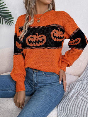 Orange acrylic knit sweater with black jack-o'-lantern intarsia pattern and crew neck.
