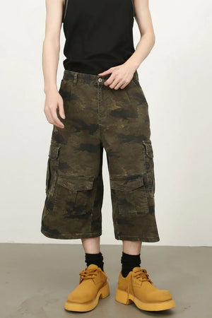 Camo culotte cargo shorts in green camouflage with multiple pockets.