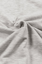 Light gray marled tunic with cowl neckline and drape front detail.