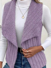 Purple fleece vest with open front and shawl collar, styled with a white turtleneck and jeans.