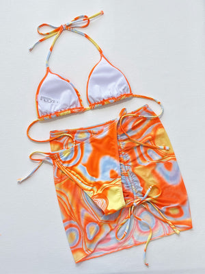 Multicolor swirl print string bikini set with a matching wrap skirt.