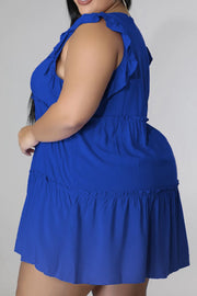 Royal blue tiered ruffle babydoll mini dress with ruffled neckline and hem.