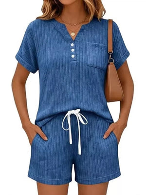 Blue ribbed knit loungewear set with v-neck henley top and drawstring shorts.