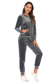 Velvet loungewear set in charcoal with zip-up hoodie and jogger pants.