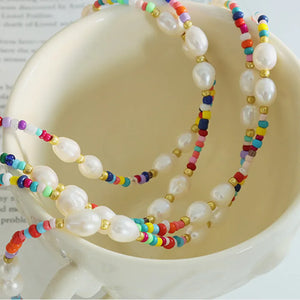 Gold choker necklace with baroque pearls and colorful seed beads