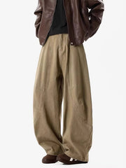 Men's taupe wide-leg sweatpants with panel detailing and a relaxed fit.