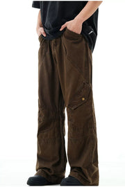 Brown cargo pants with snap pockets and detailed stitching.
