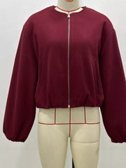 Burgundy cropped bomber jacket with zip front and elasticated hem.
