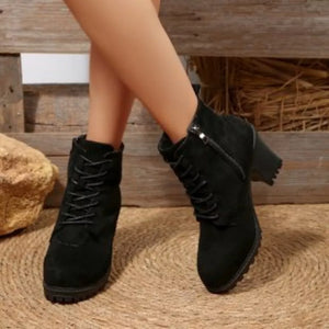 Black suede lace-up ankle boots with block heel and side zipper detail.