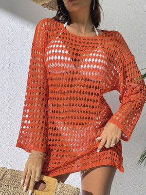 Sheer crochet knit cover-up in pumpkin with openwork pattern and long sleeves.