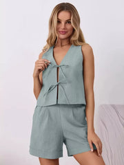 Blue cotton tie-front sleeveless top and cuffed shorts set.