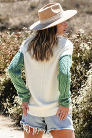 Textured panel pocket sweater in cream with matcha green cable knit sleeves.