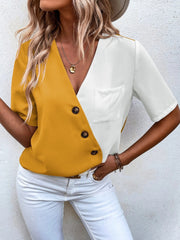 Two-tone mustard and white asymmetric button-down shirt with a pocket and V-neck.