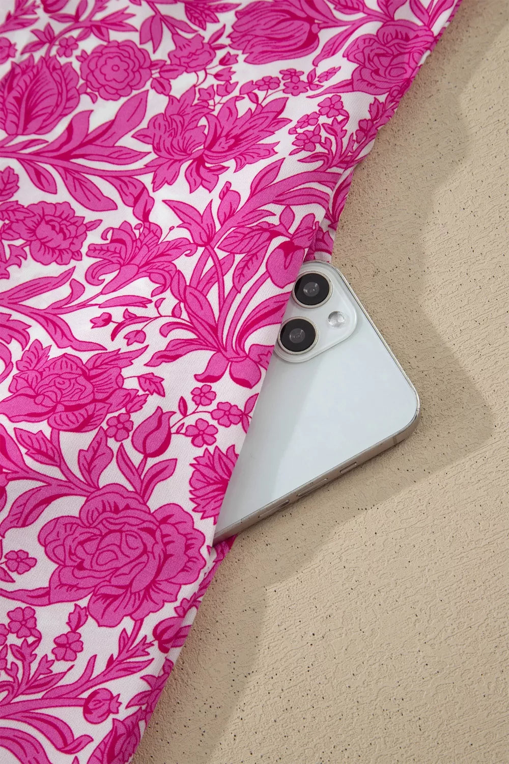 Vibrant floral midi dress with ruffle sleeves and a hidden pocket detail.